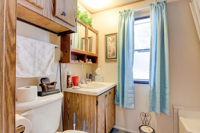 bathroom featuring vanity and toilet