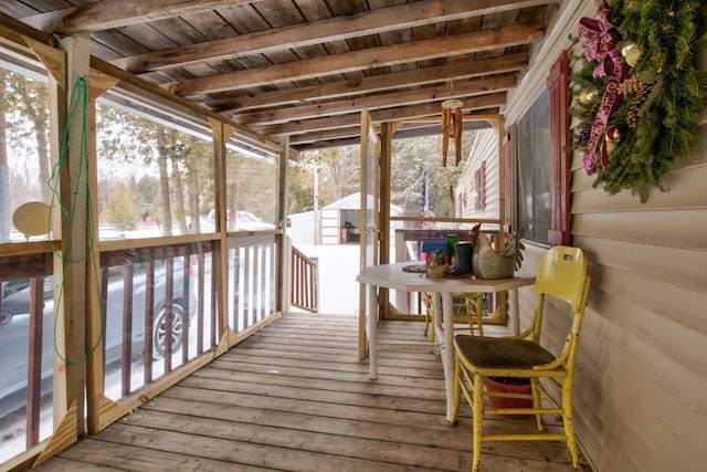 sunroom / solarium with beam ceiling and wood ceiling