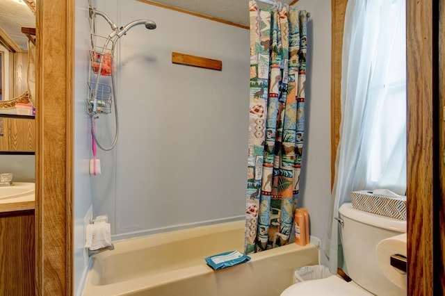 full bathroom featuring vanity, shower / bath combination with curtain, and toilet