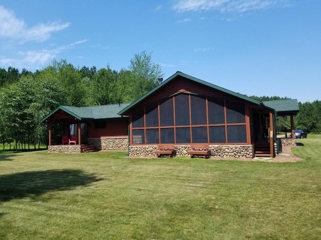 back of house with a yard