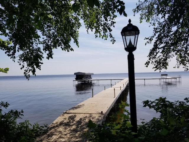 dock area featuring a water view