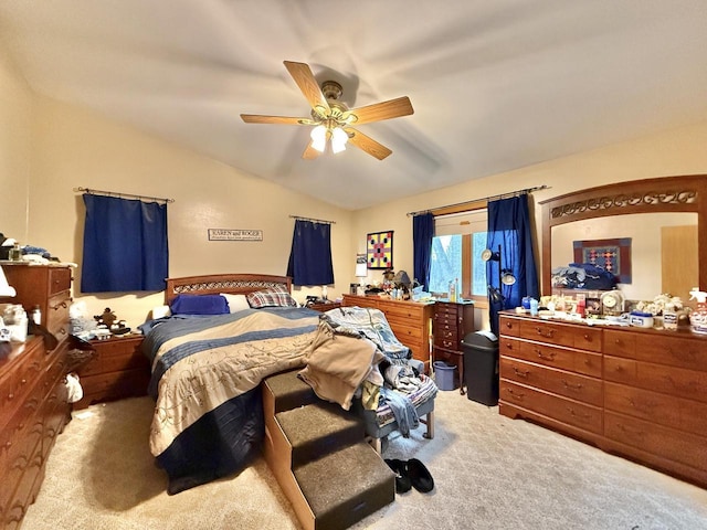 carpeted bedroom featuring lofted ceiling and ceiling fan