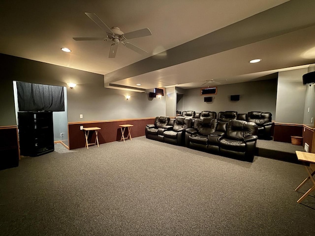 carpeted cinema featuring ceiling fan