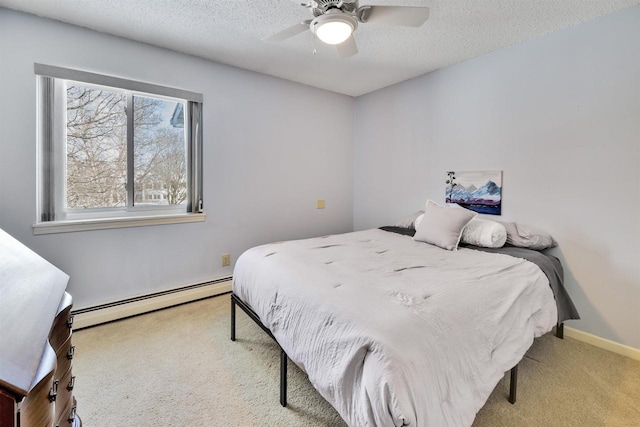 carpeted bedroom featuring ceiling fan, a textured ceiling, and a baseboard heating unit