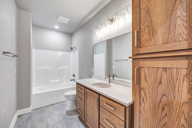 full bathroom featuring washtub / shower combination, vanity, and toilet