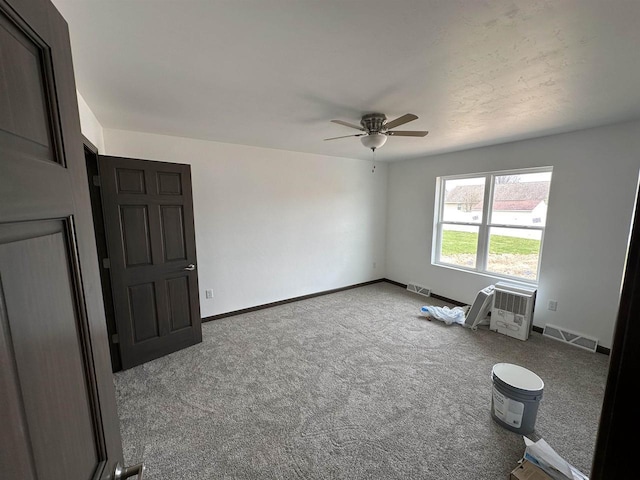 empty room with carpet flooring and ceiling fan