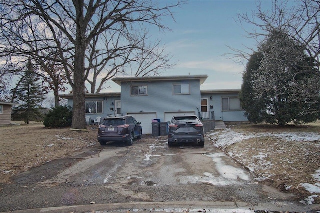 split level home featuring a garage