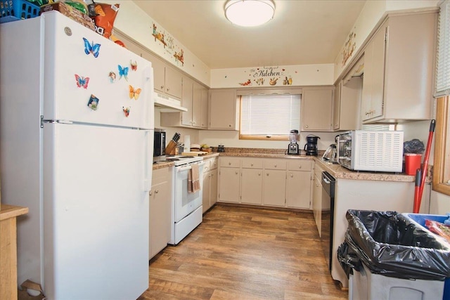 kitchen with white appliances, light hardwood / wood-style floors, and cream cabinets