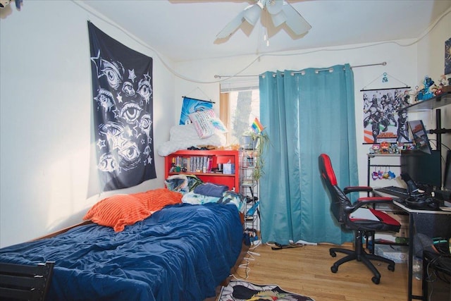 bedroom featuring ceiling fan and wood-type flooring