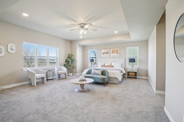 bedroom with carpet flooring, multiple windows, and baseboards