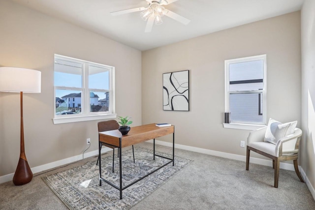 office with baseboards, carpet, and a ceiling fan