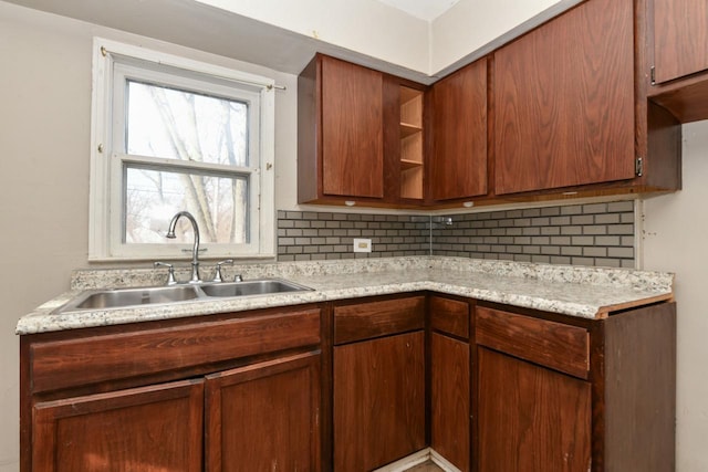 kitchen with tasteful backsplash and sink