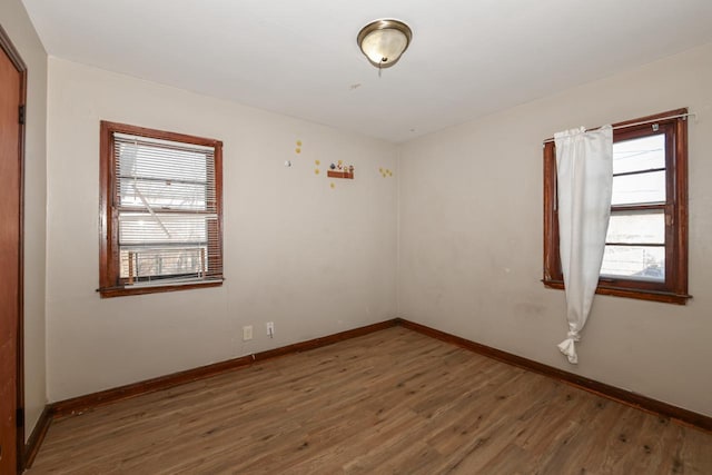 unfurnished room featuring dark hardwood / wood-style floors