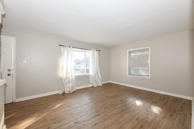 empty room featuring dark wood-type flooring