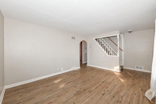 empty room with hardwood / wood-style floors