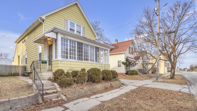 view of front of property with a sunroom