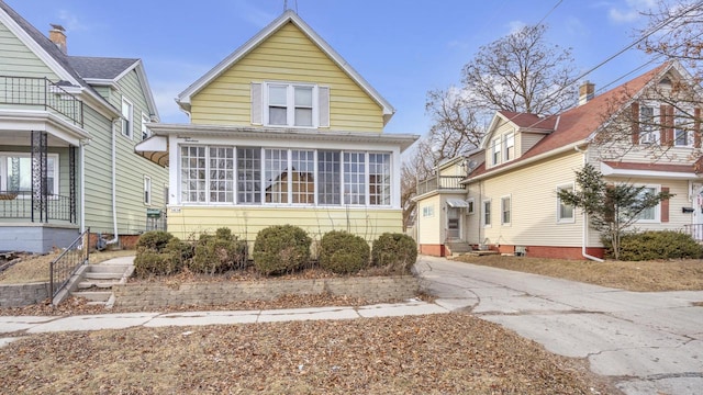 view of front facade with a sunroom