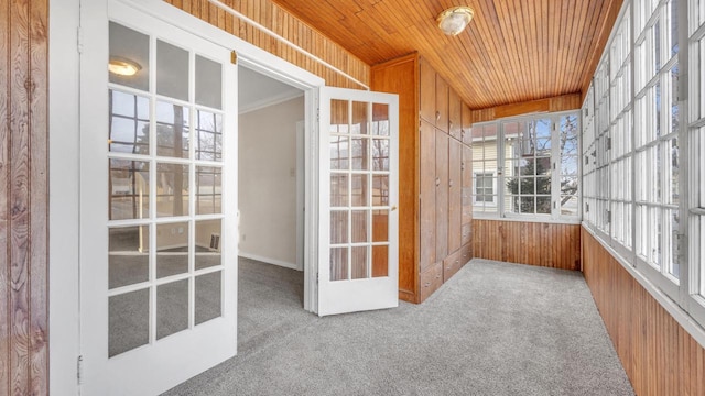 unfurnished sunroom featuring wooden ceiling