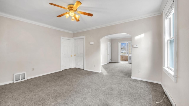 unfurnished room with crown molding, ceiling fan, and carpet floors