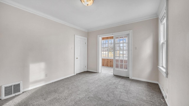 carpeted spare room with ornamental molding