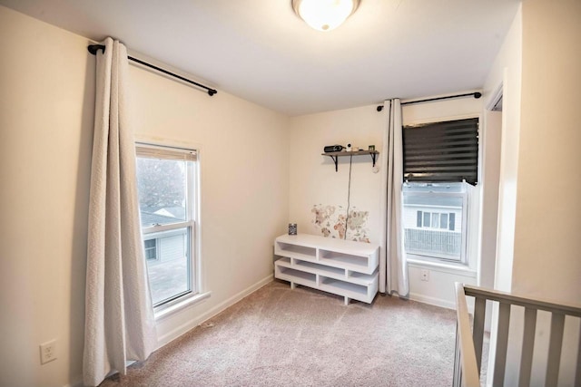 bedroom featuring light carpet