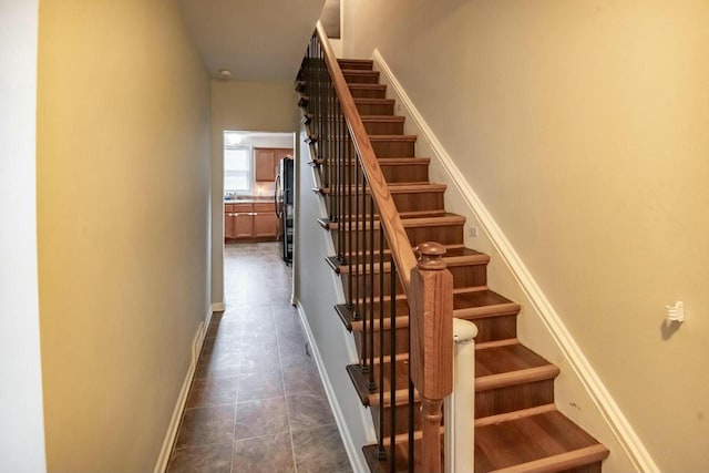 stairway featuring tile patterned floors