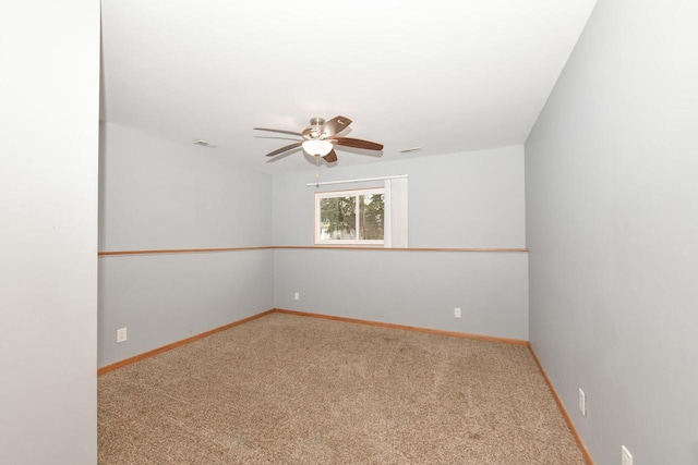 unfurnished room with ceiling fan and carpet flooring