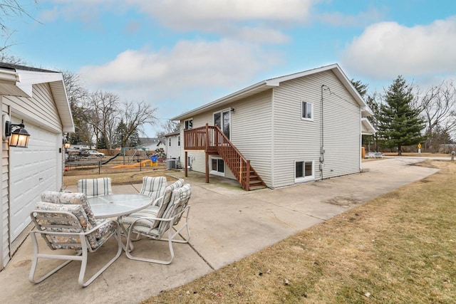 exterior space with a wooden deck and central air condition unit