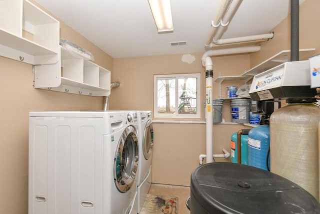 washroom featuring washer and clothes dryer