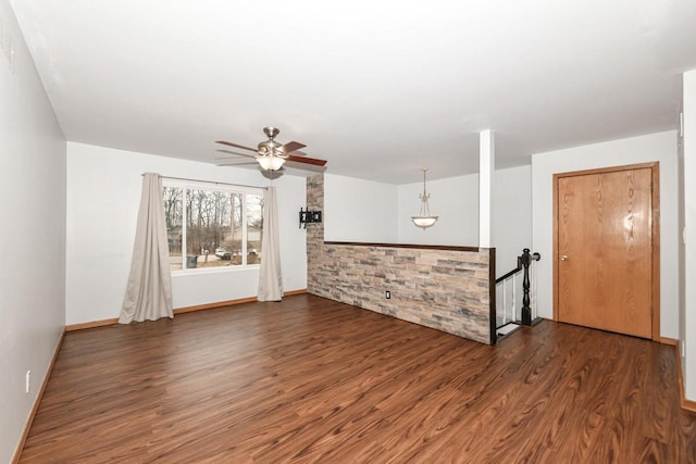 empty room featuring dark hardwood / wood-style floors and ceiling fan