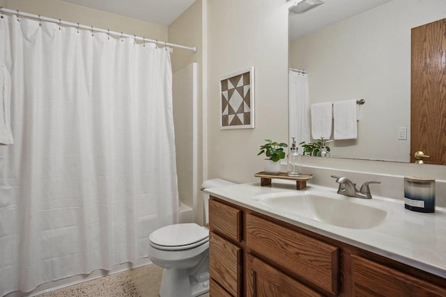 full bathroom with shower / bath combination with curtain, vanity, and toilet