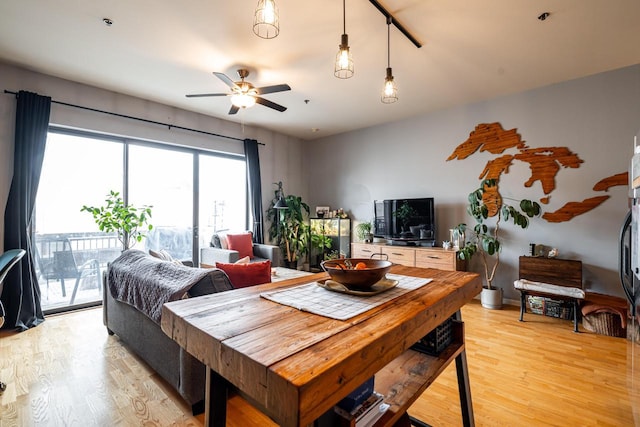 dining area featuring ceiling fan and light hardwood / wood-style flooring