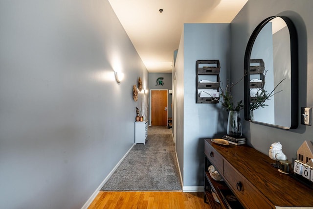 corridor with hardwood / wood-style floors