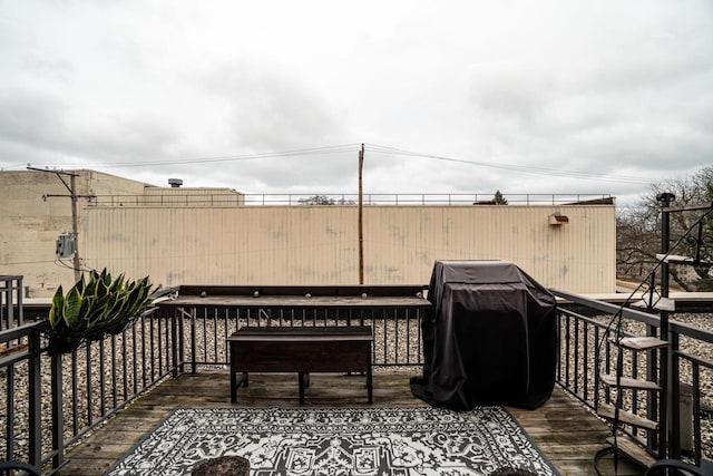 wooden deck featuring area for grilling