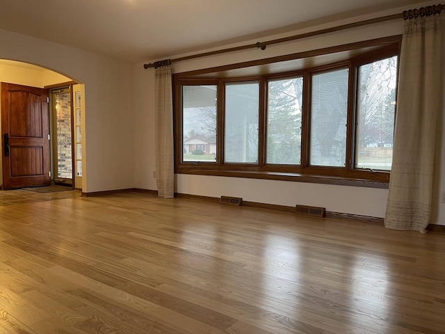 spare room with hardwood / wood-style flooring