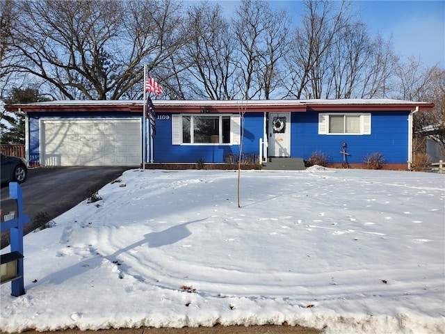 ranch-style home with a garage