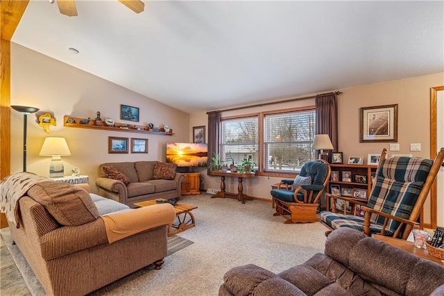 carpeted living room featuring ceiling fan and lofted ceiling