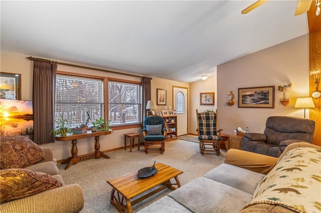 living room featuring vaulted ceiling and light colored carpet