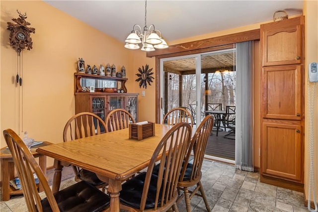 dining space with a notable chandelier