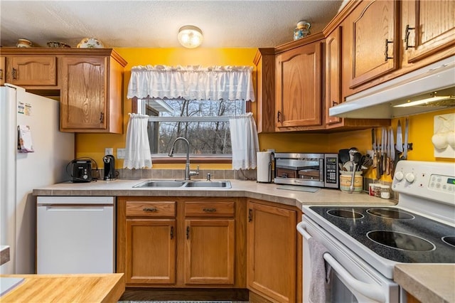 kitchen featuring dishwashing machine, sink, a textured ceiling, and white range with electric stovetop