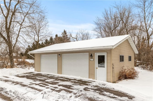 view of snow covered garage