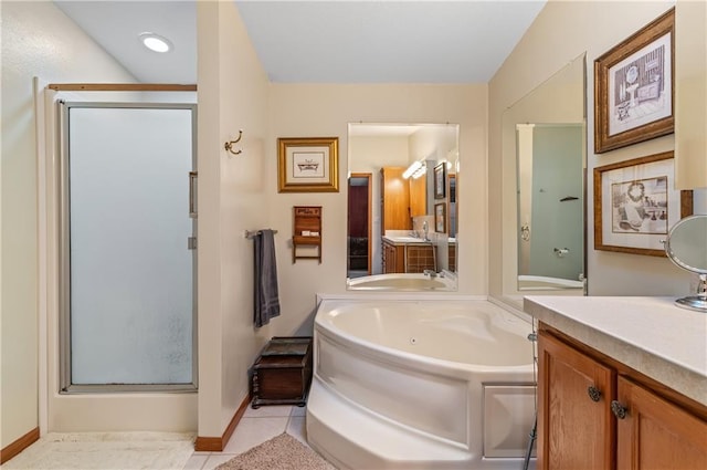 bathroom with vanity, tile patterned floors, and plus walk in shower