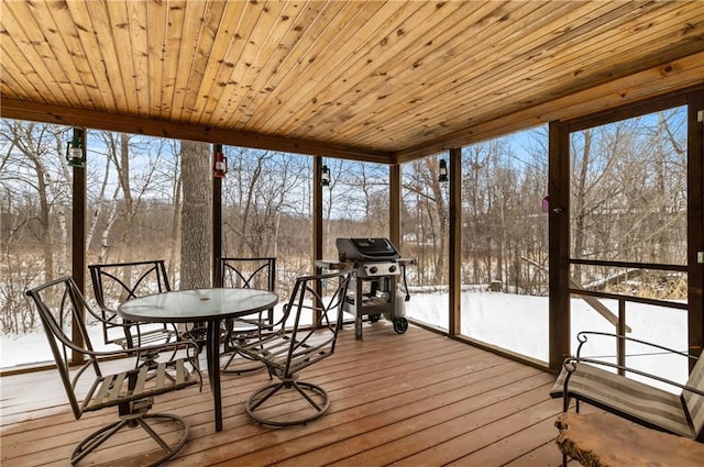 unfurnished sunroom with wooden ceiling