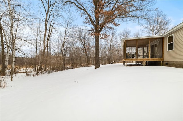 view of yard covered in snow