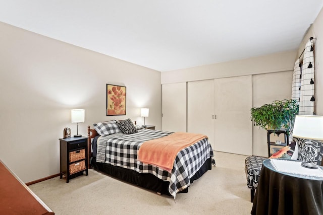 carpeted bedroom featuring a closet