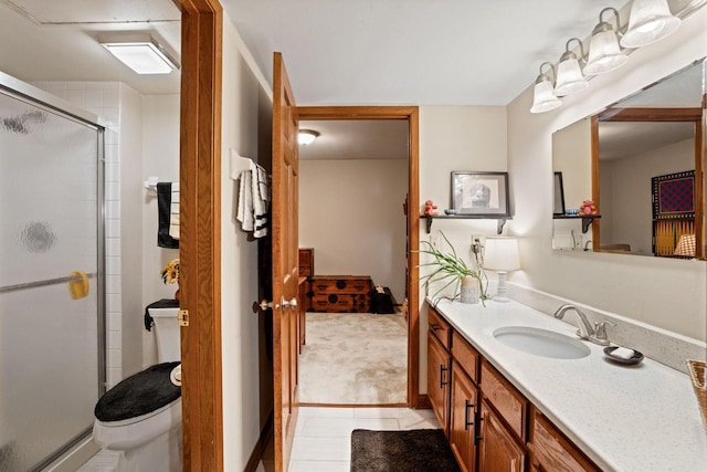 bathroom with walk in shower, tile patterned floors, vanity, and toilet