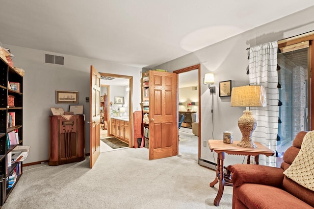 sitting room with light colored carpet