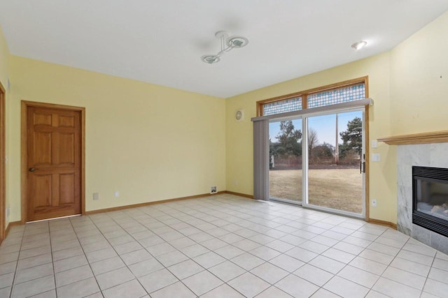 unfurnished living room featuring light tile patterned flooring and a fireplace