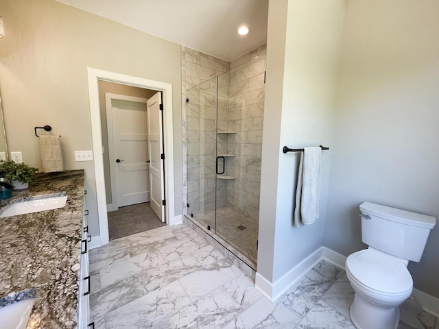 bathroom featuring vanity, toilet, and walk in shower