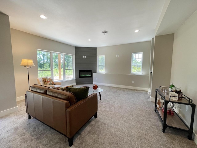 carpeted living room with a fireplace